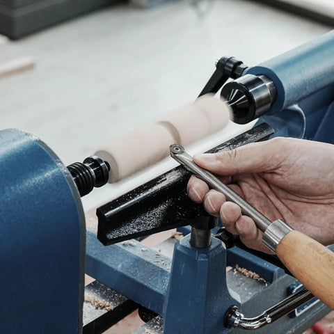 Person using woodturning lathe with Pen Mandrel Bundle For Woodturning Lathe With Mandrel Saver, 2MT Taper for pen making.