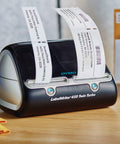 Straight Up Twin Turbo Direct Thermal Label Printer With Dual Roll Setup for Fast Shipping Labels printing labels on a desk.
