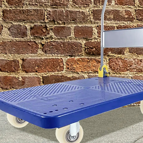 Top Notch 4 Pack 1.5 Inch Nylon Caster Wheels on a blue dolly against a brick wall for smooth movement.