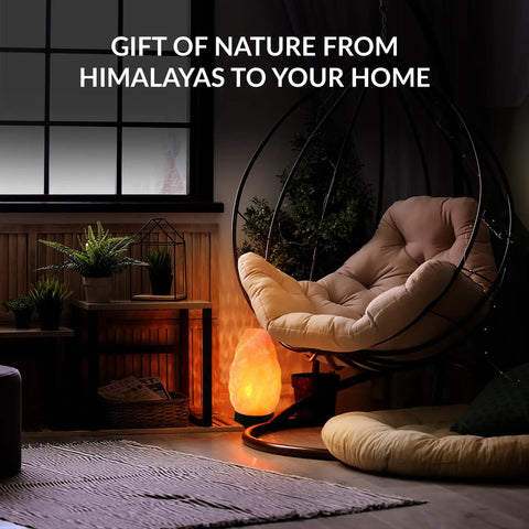 Multicolor USB LED Salt Lamp With Plastic Base For Home Office Dorm Decor, hand-carved salt lamp glowing beside a chair in a cozy room.