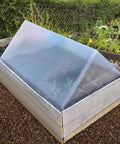 Heavy Duty Twin Wall Polycarbonate Greenhouse Panels 14 Pack Four By Two Feet High Light Transmission Garden Roofing Sheets in garden bed.
