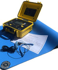 Open yellow ESD mat kit case displaying control unit, ground cord, and wrist strap beside a blue anti-static mat.