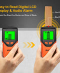 Wall Stud Finder with digital LCD display showing stud center and edge, held in hand against a wall.