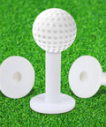 Premium Rubber Golf Tees For Mats And Driving Range 12 Piece Set shown on artificial grass with golf ball on tee.