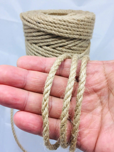 Close-up of hand holding 328 Feet Of 5mm Jute Twine Heavy Duty Workhorse Natural Hemp Rope For DIY Arts Crafts Gardening Bundling