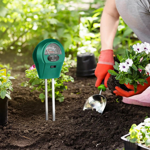 3 In 1 Soil Moisture Light And pH Tester Battery Free Gardening Tool in use with garden plants and shovel nearby