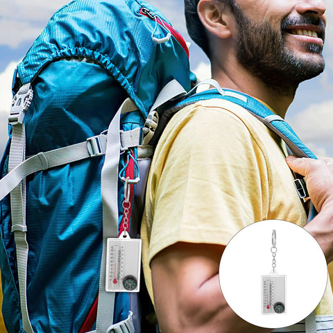 Hiker with backpack featuring Two Pack Portable Keychain Compass With Thermometer Wear Resistant Mini Pocket Navigator attached