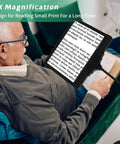 Elderly person using 5X Rechargeable Floor Magnifying Glass With Light And Stand 43 LED Handy Hands Free Magnifier for reading.