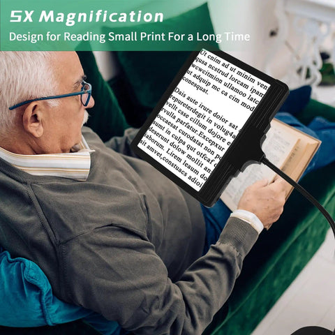 Elderly person using 5X Rechargeable Floor Magnifying Glass With Light And Stand 43 LED Handy Hands Free Magnifier for reading.