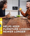 Quick Fix Wood Furniture Polish Spray For Stainless Steel And Hardwood Erases Sticky Fingerprints And Dust With A Zesty Lemon Scent on a dining table.