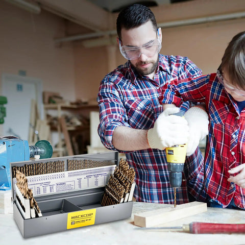 Father and son using Heavy Duty 115 Piece M35 Cobalt Drill Bit Set for drilling into wood in a workshop.