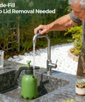 Man refilling Half Gallon Hand Pump Sprayer For Home Garden Chores And Household Care With Easy Side Fill Port in a garden sink