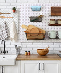 Kitchen with Six Piece Pegboard Baskets Set Wall Mount Wire Pegboard Baskets in Three Sizes, organized with tools and crafts.