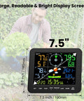 All In One Indoor Outdoor Weather Station With Rain Gauge And Wind Speed, Forecast, Temperature, Humidity, Moon Phase, Alarm Clock, Backlit 7.5 Inch Color Display, Easy To Read Large Display, No WiFi Needed showing in a garden setting