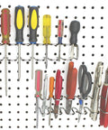 Two Pack Pegboard Screwdriver And Pliers Holder mounted on white pegboard, holding multiple screwdrivers and pliers.