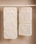 Game Changer 2 Pack Mesh Hanging Closet Storage Organizers Beige Foldable Bra And Sock Storage Pockets Anti Tangle Wardrobe Bags hung in a closet.