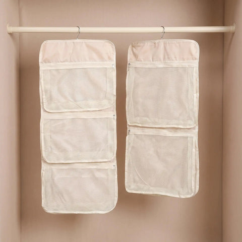 Game Changer 2 Pack Mesh Hanging Closet Storage Organizers Beige Foldable Bra And Sock Storage Pockets Anti Tangle Wardrobe Bags hung in a closet.