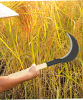 Person using a Long Handled Hand Scythe for Weeding in the Garden with Heavy Duty Manganese Steel Blade Japanese Style Garden Tool