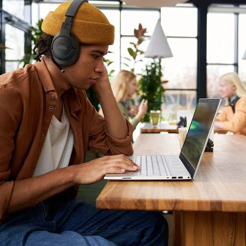 Person using Adaptive Noise Cancelling Wireless Over Ear Headphones With Smart Ambient And Bluetooth 5.3 Up To 70 Hours Battery Life