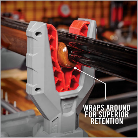 One-Hand Clamp Gun Workstation with non-marring, form-fitting yokes securely holding firearm, ideal for gun cleaning and maintenance.