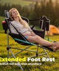 Woman relaxing on Oversized Hammock Camping Chair With Footrest, Swing Rocker Design, Adjustable Back And Seat Angles outdoors