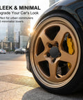 Road Ready 4 Pack Universal Car Wheel Center Caps 2.36 Inch Snap In Hub Cover Replacement Abs Plastic Rim Caps For Daily Drivers Trucks Suvas Quick Swap Slick Black Finish on gold wheel in urban setting.