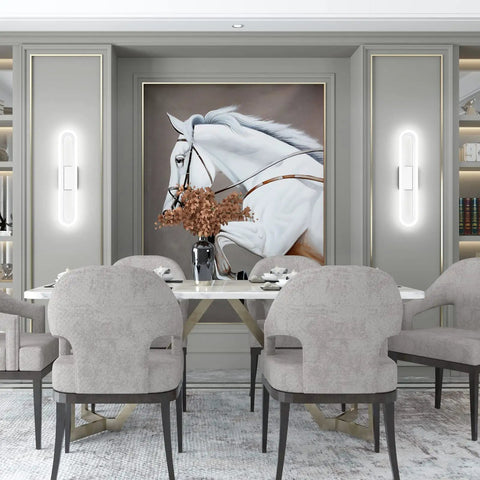 Dining room with large horse painting, surrounded by modern gray chairs, table, and LED wall sconces illuminating the artwork.