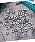 Heavy Duty Stainless Steel Hex Nuts Rock Solid Hardware Fasteners For Home Repairs And Industrial Projects polished steel with detailed threads.