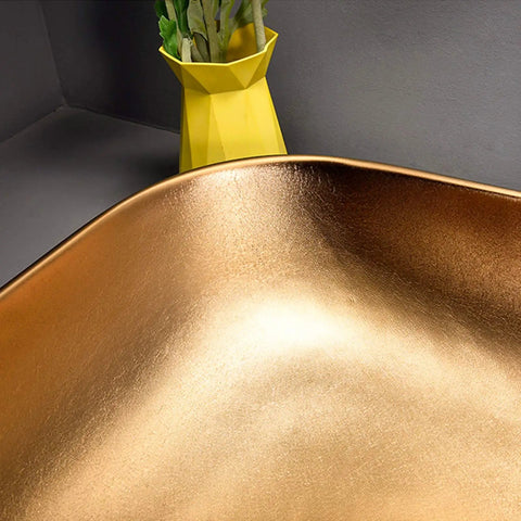 Close-up view of Premium Porcelain Vessel Sink For Above Counter Bathroom Vanity with smooth gold finish.