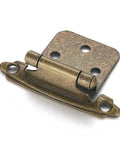 Antique Brass Cabinet Hinges Spice Up Your Kitchen Without Fuss, 1/2 inch overlay face frame hinge, close-up view.