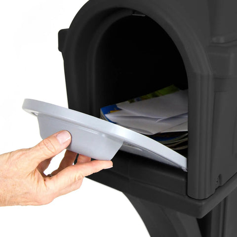 Hand holding a gray mail access door for the Top Grade Classic Black Plastic Residential Mailbox With Standalone Yard Post Mount Combo Kit.