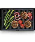 Smokeless Indoor Grill With Nonstick Cooking Surface And Adjustable Temperature From Warm To Sear For Realistic At Home BBQ Flavor Easy Cleanup With Dishwasher Safe Water Tray Black, grilling burgers, onions, asparagus and tomatoes
