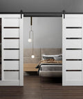 Double Barn Door Set 56 X 96 Inches with Quadro 4588 White Silk and Black Glass accents, shown in a modern bedroom setting.