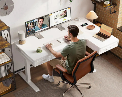 Person using L Shaped Electric Standing Desk With Four Wooden Drawers 55 Inch Height Adjustable Corner Desk With Power Outlets Space Saving Sit Stand Table For Home Office White Ideal For Any Space in home office.