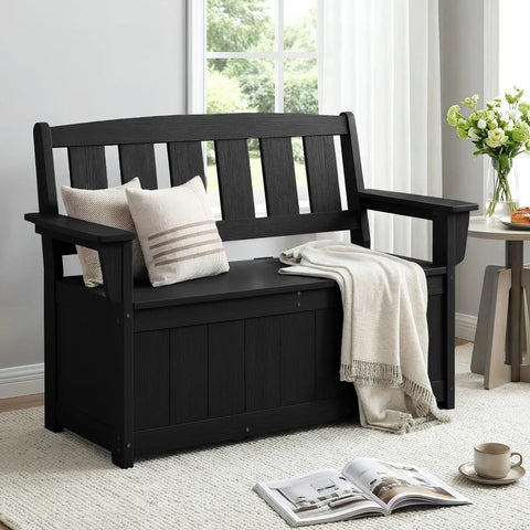 HDPE Outdoor Storage Bench With 57 Gallon Dual Use Seat And Organizer, black bench with cushions and a throw blanket, indoor setting