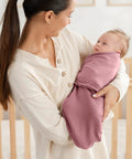 Mother holding baby in Cozy Baby Swaddle Blanket Set Three Pack 100 Percent Cotton Newborn Wraps For 0 To 3 Months in mauve.