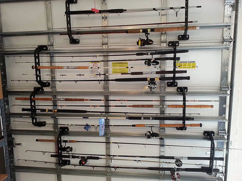 Garage Door Storage Rack for Fishing Gear 21 Inch Black ABS Rod Holder installed on garage door holding fishing rods.