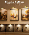 3 Pack Wireless Picture Lights For Wall, Battery Operated Poster Lamps With Polished Gold Finish, Bright 80 Lumen Art Displays illuminating paintings.
