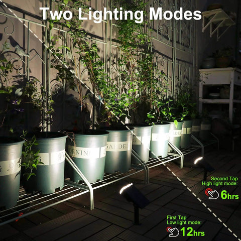 Outdoor garden with Solar Spotlight Pack, 12 LED, illuminating potted plants, showing two lighting modes, Waterproof IP67