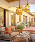 2 Pack Battery Operated Handwoven Natural Rattan Chandeliers Egg Shaped Boho Pendant Lights in a stylish outdoor patio setting.