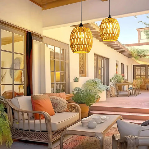 2 Pack Battery Operated Handwoven Natural Rattan Chandeliers Egg Shaped Boho Pendant Lights in a stylish outdoor patio setting.