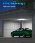 Motion Sensor Garage Light 80W 8000LM Deformable LED Shop Light illuminating a garage with parked green car