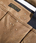 Close-up of Waxed Canvas Tool Bag 15 Inch Heavy Duty Contractor Organizer With 19 Pockets, showing tan waterproof material.