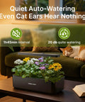 Indoor Hydroponics Garden System With 12 Pods And 24W LED Grow Light, shown on a table with flowers beside a sleeping cat