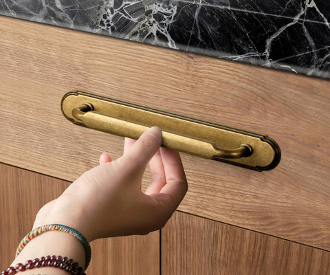 Antique Brass Cabinet Pulls With Backplate Spacer 2 Pack shown on kitchen drawer, 5 inch center to center, solid zinc alloy, corrosion resistant