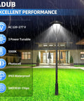 Beast Mode Bright Adjustable 60W 80W 100W LED Post Top Light With Photocell illuminating a wet outdoor yard, IP65 waterproof.