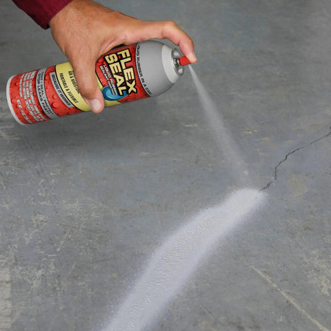 Hand spraying 14 Oz Black Waterproof Rubber Sealant Spray On Coating That Stops Leaks Instantly No Joke And Stays Flexible