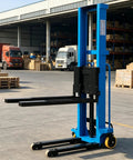Heavy Duty Electric Pallet Jack Stacker And Forklift Lift Truck For Warehouse Operations Compact Portable Material Handler with black forks.