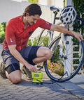 Man using 18V One Plus Cordless Tire And Ball Inflator With Mini Compressor 11 Bar Max Fast Inflation To 32 PSI In Under A Minute Includes 3 Tips Battery Not Included on bicycle tire