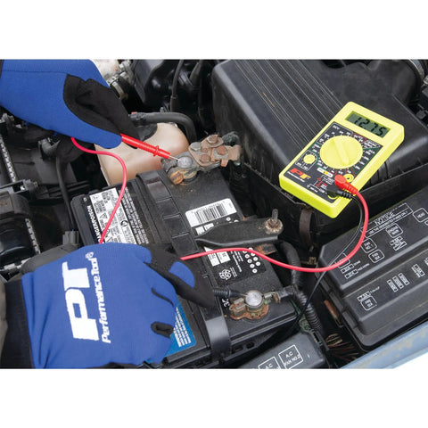 Digital Multimeter Tester 2000 Counts With AC DC Voltmeter Ohm Volt Amp Meter in use on car battery by gloved hands
